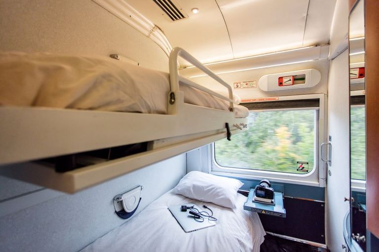 An interior of a Renaissance sleeping cabin with its bunk style beds
