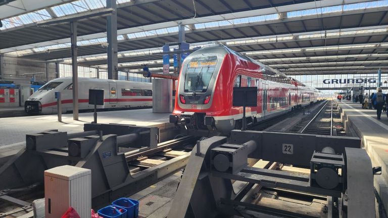 An ICE train and a smart new Regio train await departure on a glorious day for rail travel