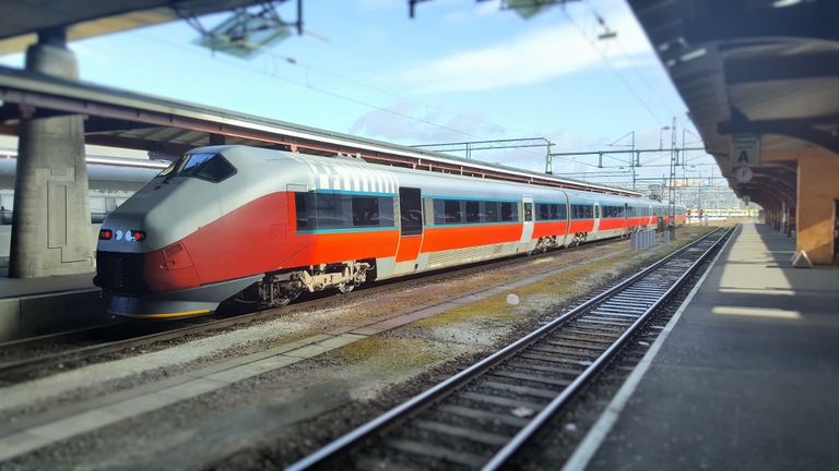 A train, which has since received a new external paint scheme, awaits departure to Oslo from Goteborg C station