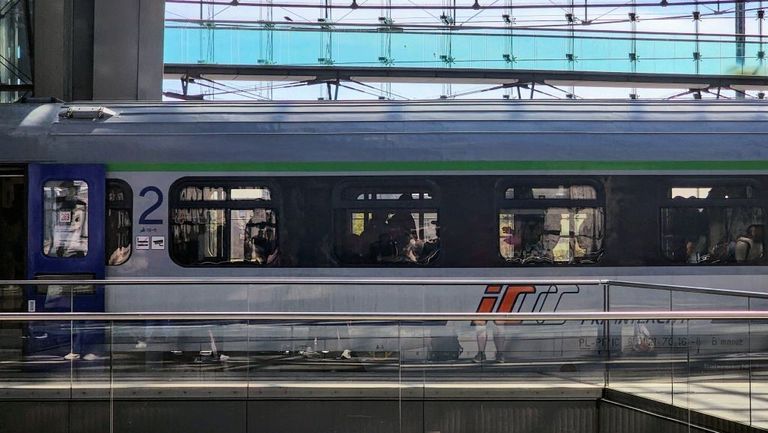 Boarding a train heading to Warszawa at Berlin Hbf