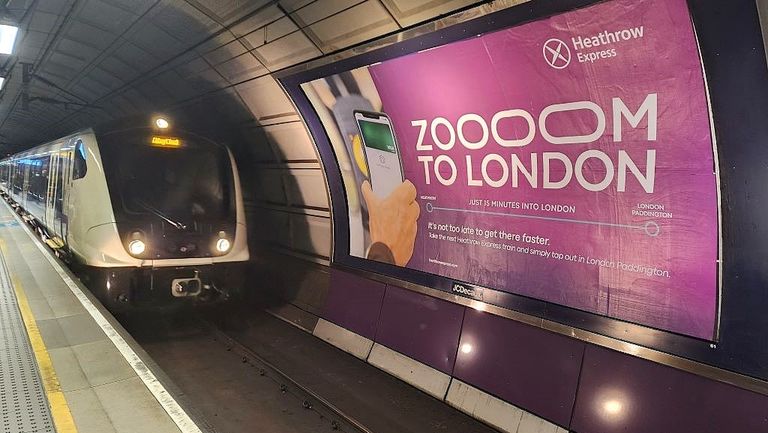 An Elizabeth line train arrives at Heathrow Central, it won't 'Zoom' to London', but the Heathrow Express is only 11 mins quicker